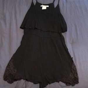 Buckle Black Romper with lace/woven leg sides